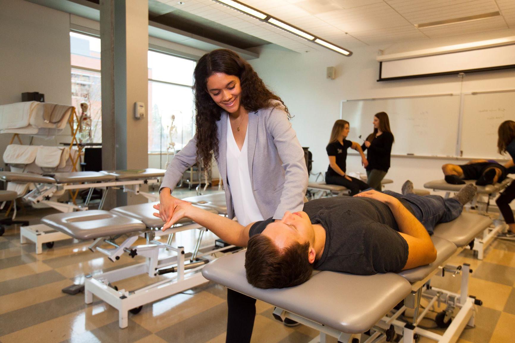 Physical Therapy students working with patients